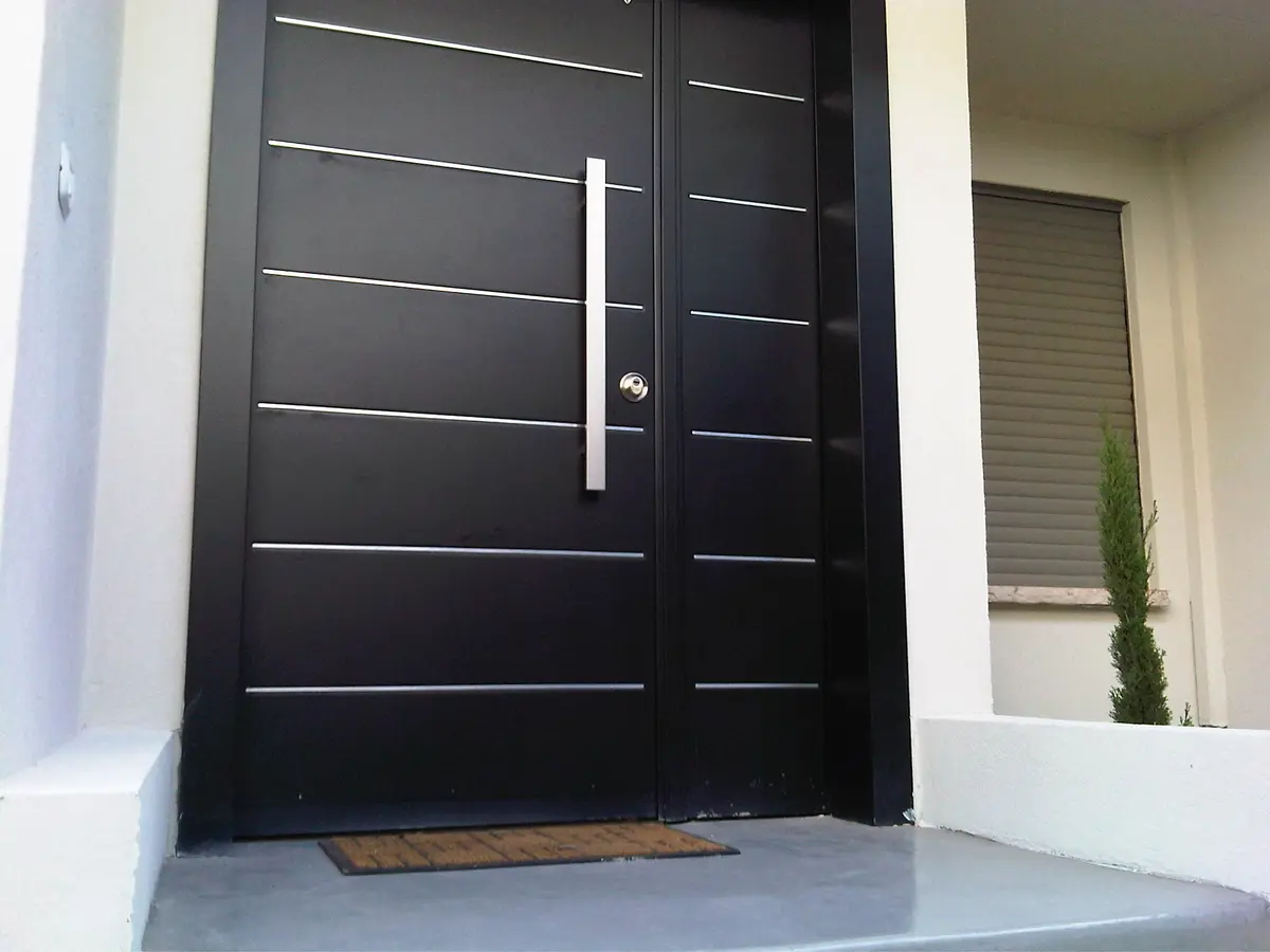 Modern dark double security door at a residential entrance